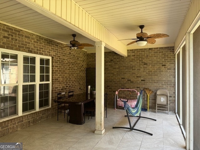 view of patio / terrace featuring ceiling fan