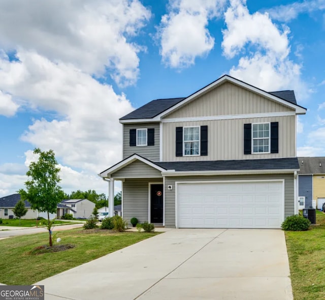 view of front of property with a front lawn, central AC unit, and a garage