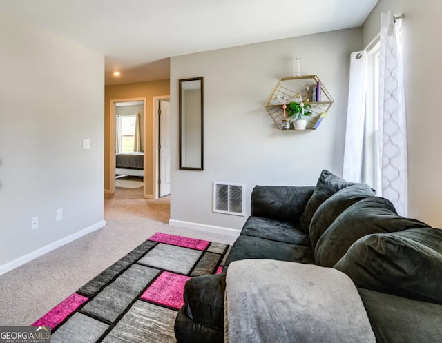 living room with light colored carpet