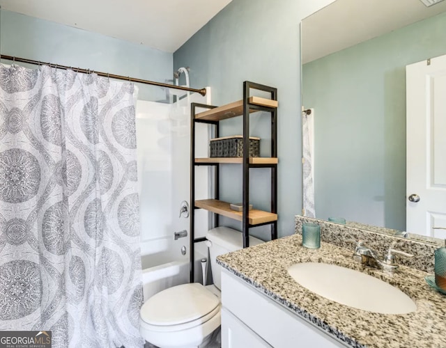 full bathroom with vanity, shower / bath combo, and toilet