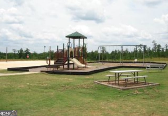 view of playground with a yard