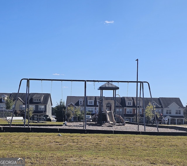 view of playground with a yard