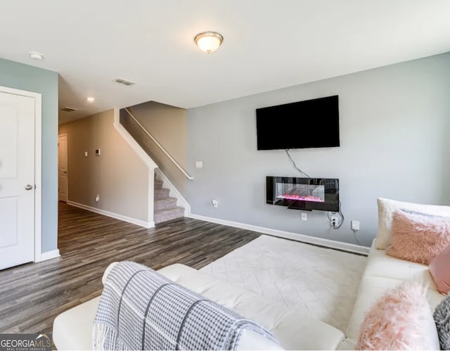 living room featuring dark wood-type flooring