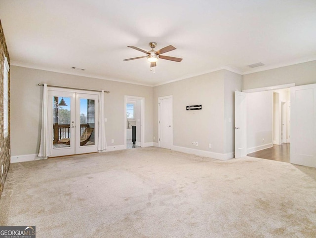 unfurnished living room with french doors, carpet floors, ceiling fan, and crown molding