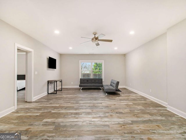 unfurnished room featuring light wood-type flooring and ceiling fan