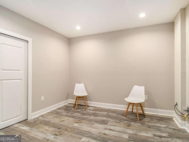 unfurnished room with wood-type flooring