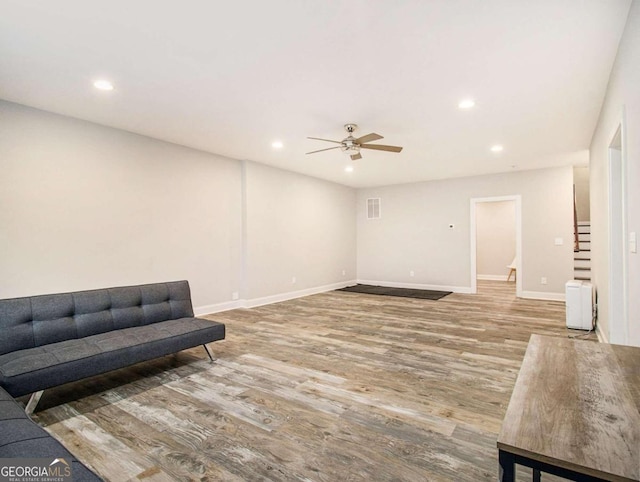 interior space with light hardwood / wood-style floors and ceiling fan