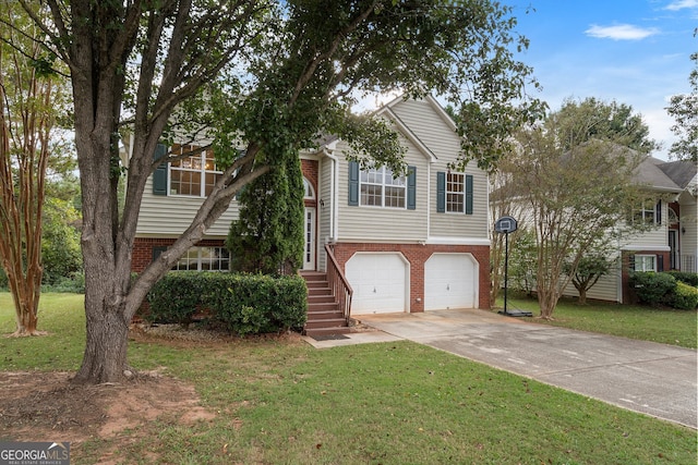 split foyer home featuring a front yard and a garage