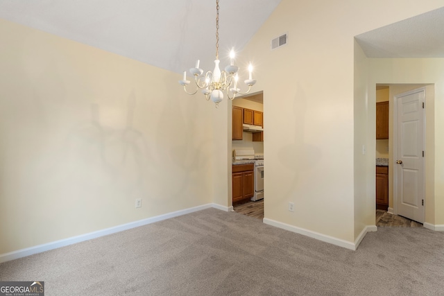 interior space featuring light carpet, a notable chandelier, and high vaulted ceiling