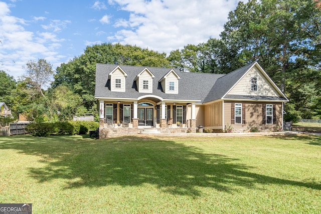 view of front of house featuring a front yard and a porch