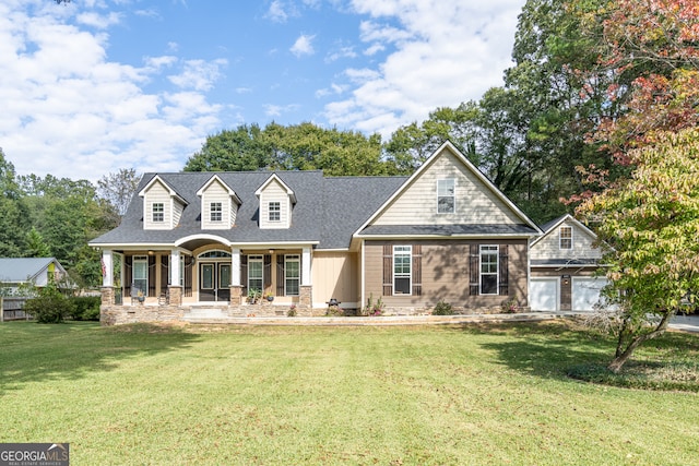 view of front of home with a porch and a front yard