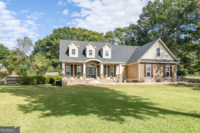 view of front of property with a front yard and a porch