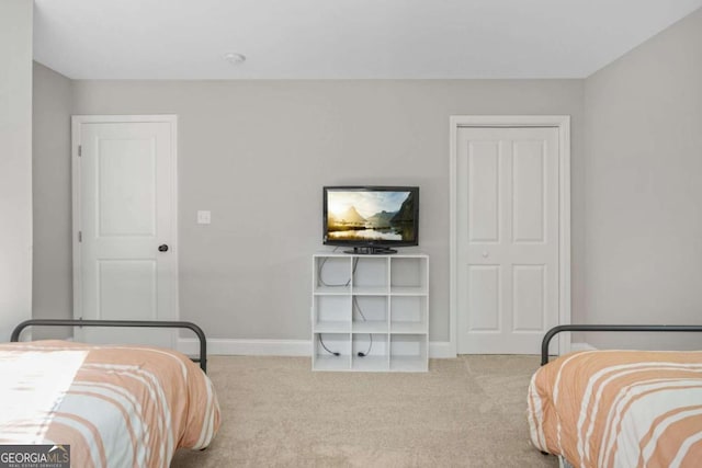 carpeted bedroom with a closet