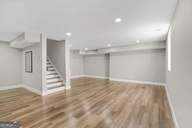 basement featuring light hardwood / wood-style floors