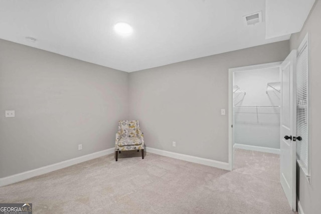 unfurnished room with light carpet