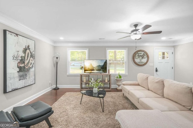 living room featuring crown molding, dark hardwood / wood-style floors, and ceiling fan