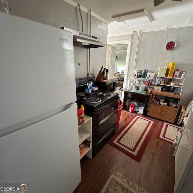 kitchen with black electric range oven, white refrigerator, and dark hardwood / wood-style floors