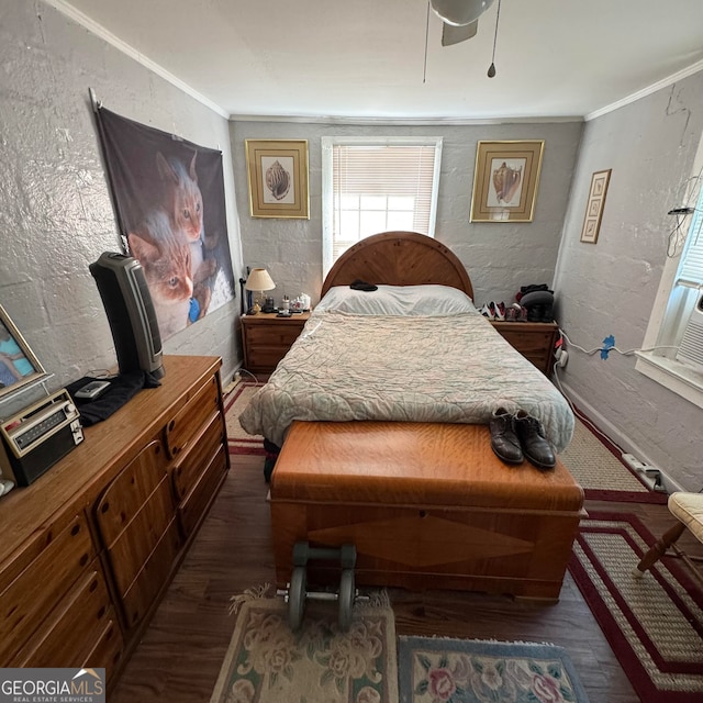 bedroom featuring ceiling fan, ornamental molding, and dark hardwood / wood-style flooring