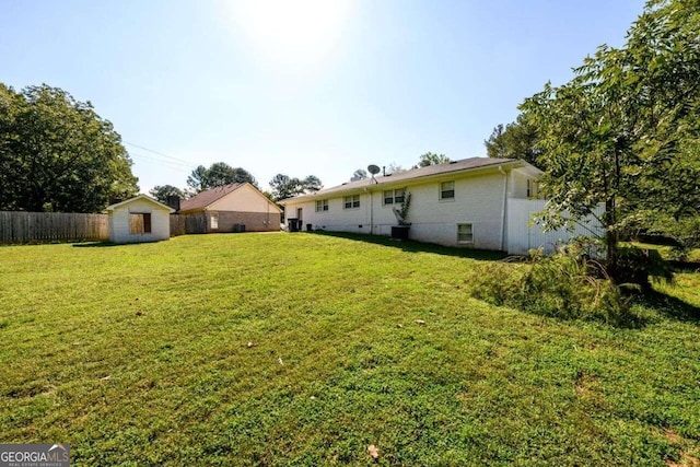 view of yard featuring a storage unit