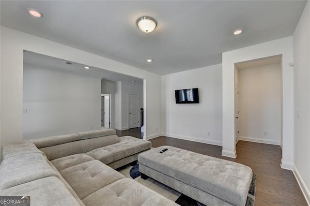 living room featuring dark wood-type flooring