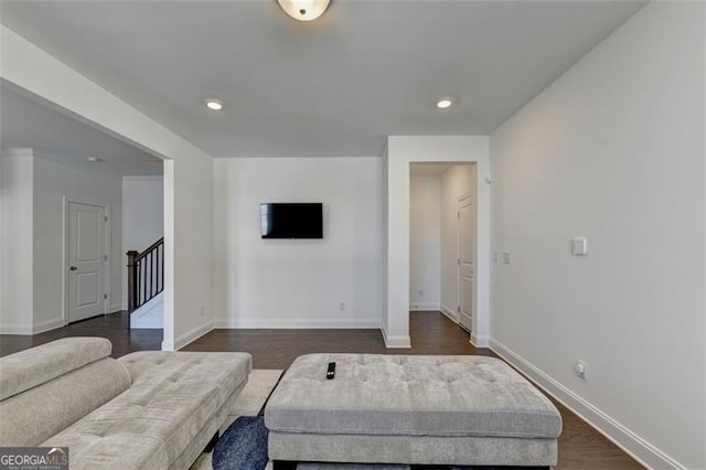 living room with dark hardwood / wood-style flooring