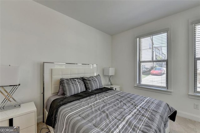 bedroom with light colored carpet