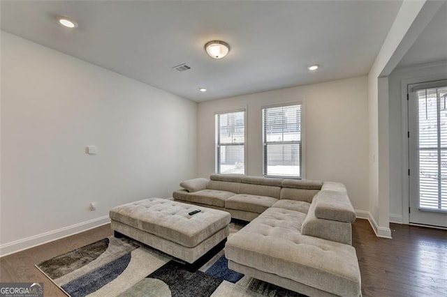 living room featuring dark hardwood / wood-style floors