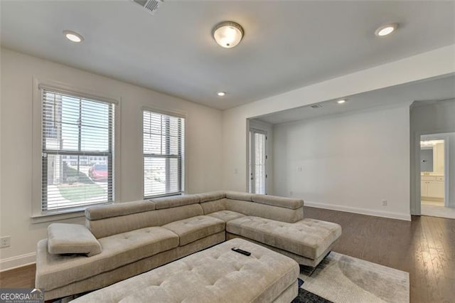 living room featuring dark hardwood / wood-style floors