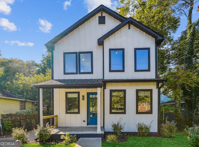 modern inspired farmhouse featuring covered porch