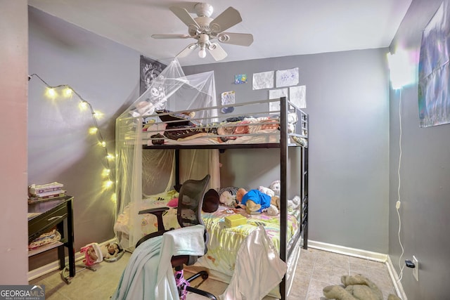 bedroom featuring light tile patterned flooring and ceiling fan