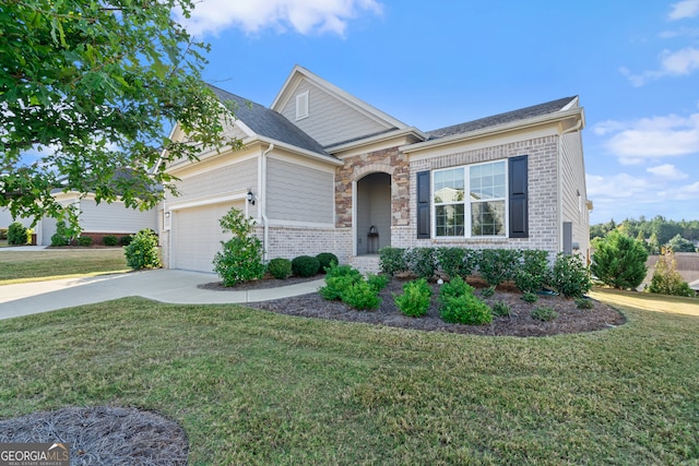 view of front facade with a front yard and a garage