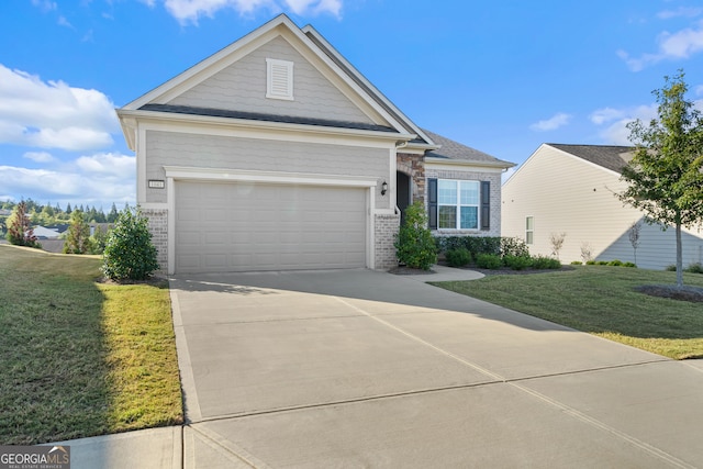 view of front of home with a front lawn and a garage