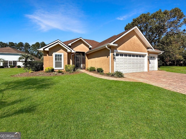 ranch-style house with a garage and a front yard