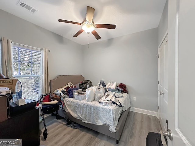 bedroom featuring light hardwood / wood-style flooring and ceiling fan