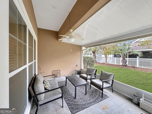 sunroom featuring plenty of natural light and ceiling fan