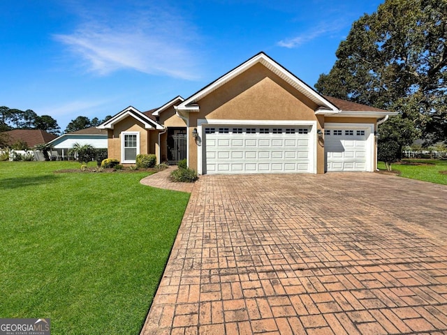 ranch-style house featuring a garage and a front yard