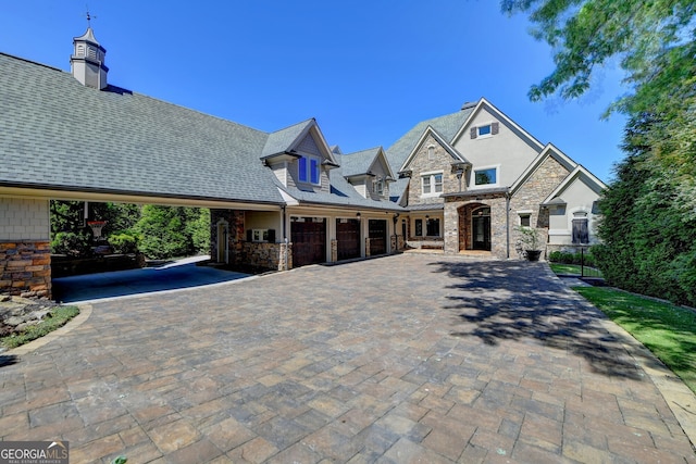 view of front of house featuring a carport and a garage