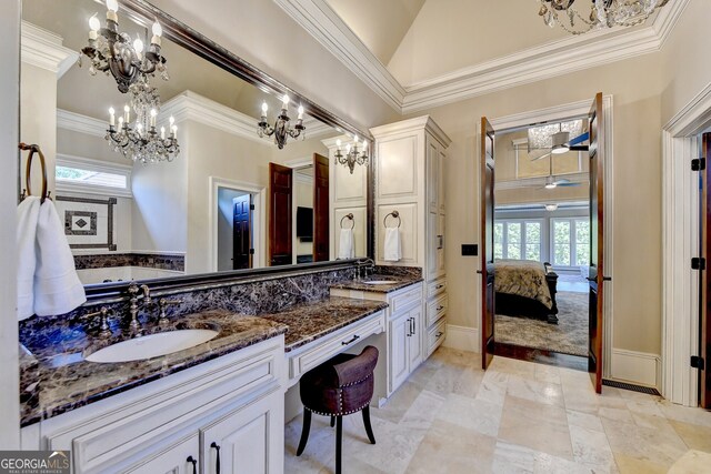 bathroom with vanity, crown molding, ceiling fan with notable chandelier, and plenty of natural light