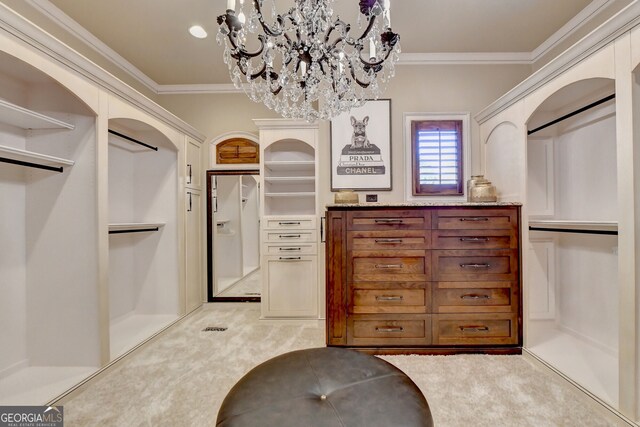 bathroom featuring vanity, crown molding, and a notable chandelier