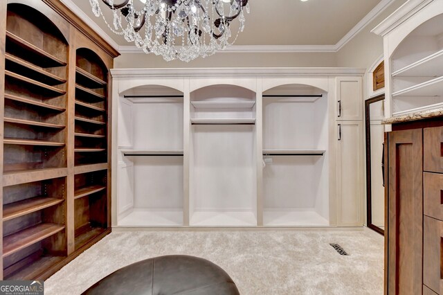 spacious closet featuring a notable chandelier