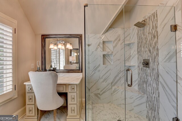 bathroom with vanity, lofted ceiling, and walk in shower