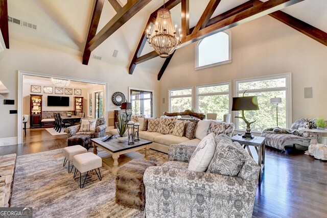 living room with beamed ceiling, a notable chandelier, high vaulted ceiling, and dark hardwood / wood-style flooring