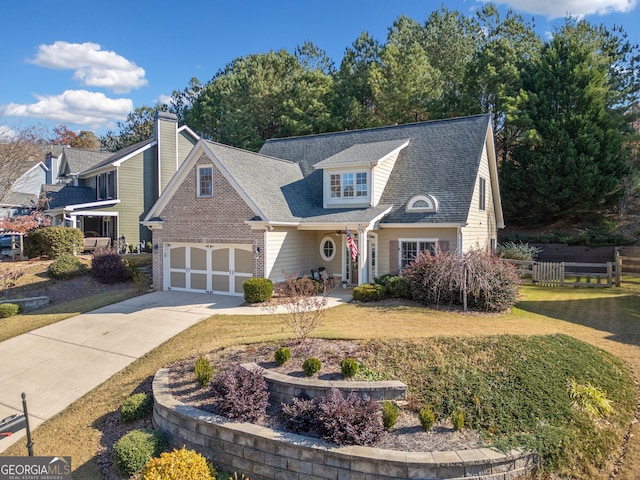 view of front of home with a garage and a front lawn