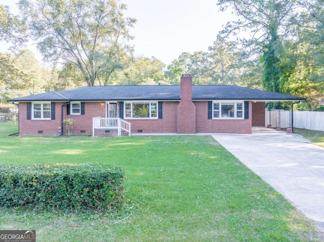 single story home featuring a carport and a front lawn