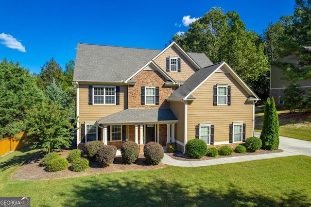 view of front of property featuring a front yard and a porch