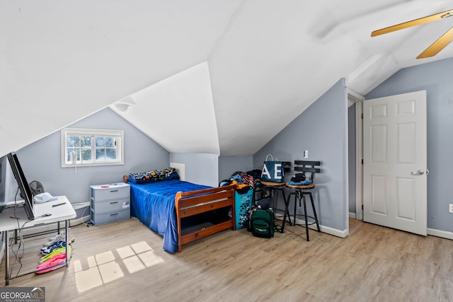 bedroom with lofted ceiling, light wood-type flooring, and ceiling fan