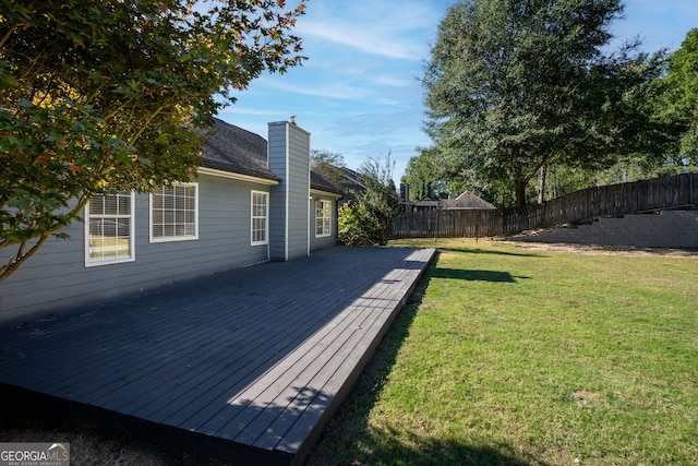 wooden deck with a yard