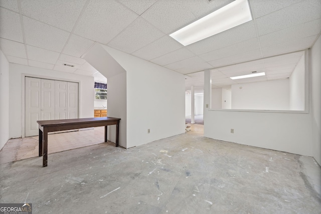 interior space featuring a drop ceiling