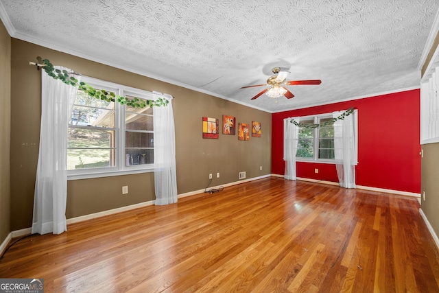 unfurnished room featuring a textured ceiling, hardwood / wood-style flooring, and ceiling fan