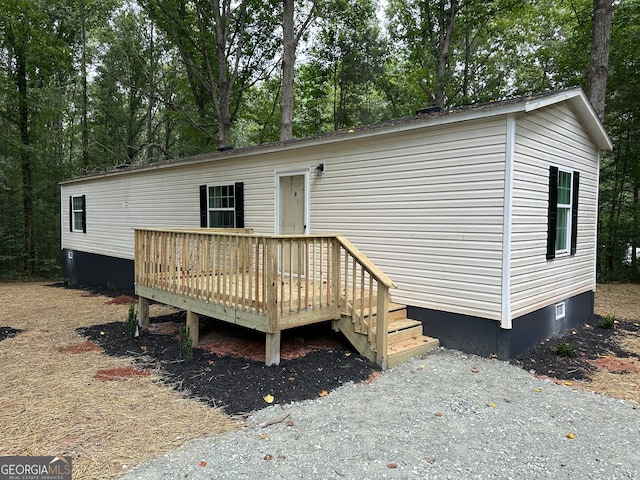 view of front of home with a wooden deck